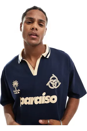 ASOS Oversized boxy polo with paraiso front print in and cream
