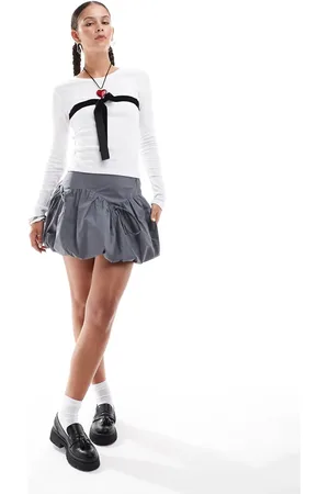 Glamorous Mid rise puff ball mini skirt with bow detail in slate