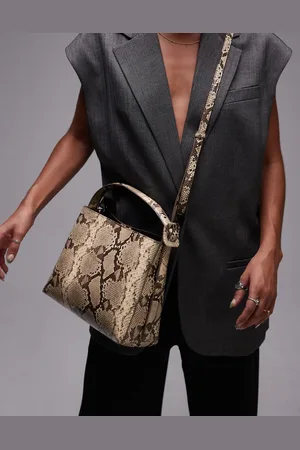 MANGO Adjustable strap handbag in snake print