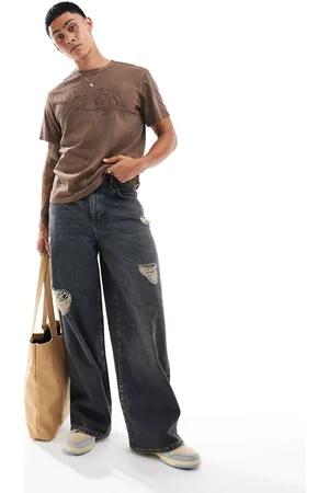 ASOS Super baggy jeans in tinted mid wash with heavy rips
