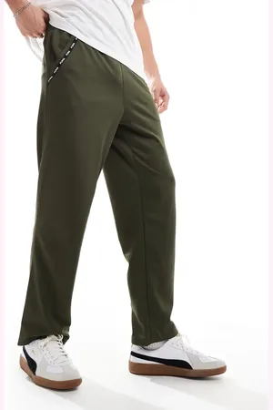 PUMA Taped PWRFleece Lite joggers in olive