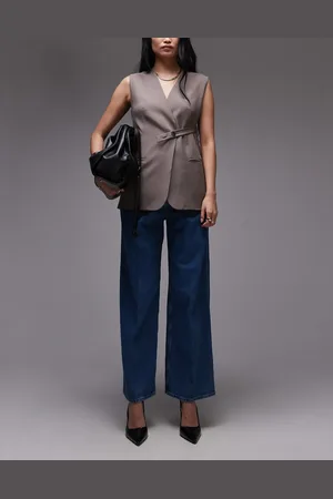 ARKET Super soft denim wide leg trousers with tailored waistband and pleat front in mid wash