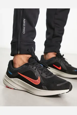 Nike Quest 5 trainers in black and orange