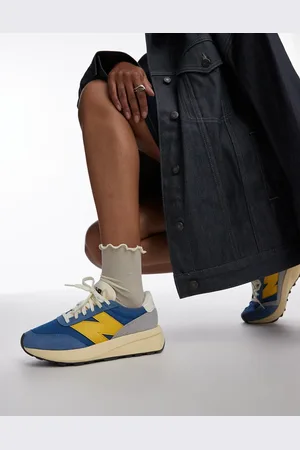 New Balance 370 trainers in and yellow