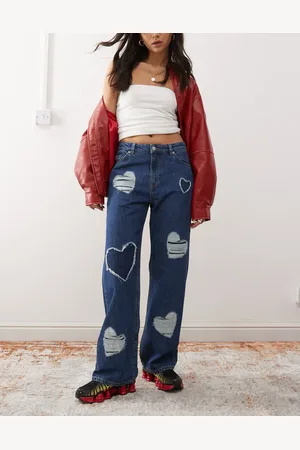 Monki Naoki low rise loose fit baggy jeans in dark wash with embossed hearts