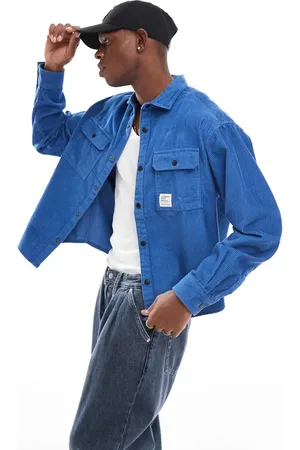 ASOS Boxy cord overshirt in blue with badge detail