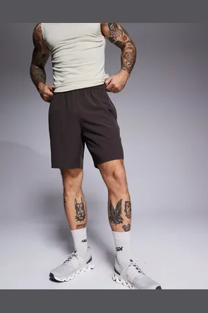 ASOS Icon 7 inch quick dry training shorts with zip pockets in dark