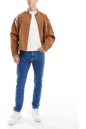 Tommy Hilfiger Austin slim tapered jeans in mid wash