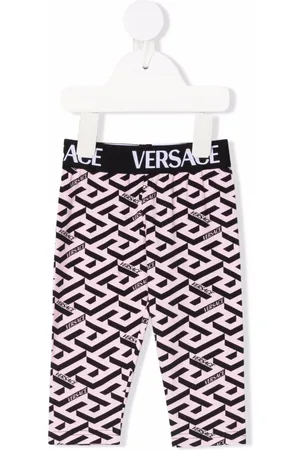 VERSACE All-over logo print leggings