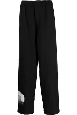 UNDERCOVER Graphic-patch wool trousers
