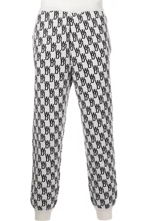 We11 Done Monogram intarsia-knit track pants