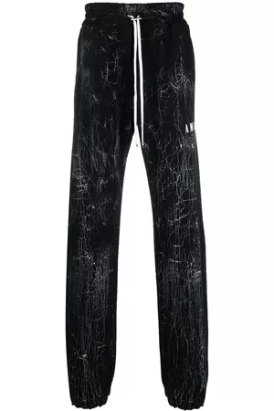 AMIRI Cracked-dye logo track pants