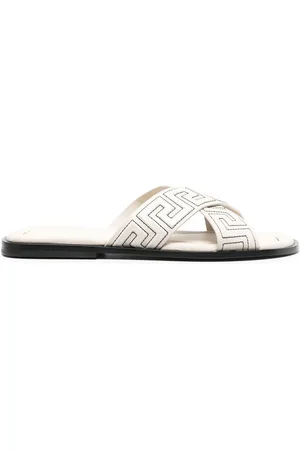 VERSACE Greca-embossed crossover-strap sandals