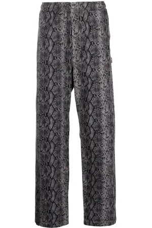 STUSSY Snakeskin-print cotton trousers