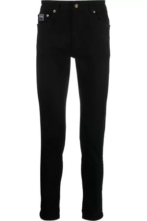 VERSACE Logo-patch cotton trousers