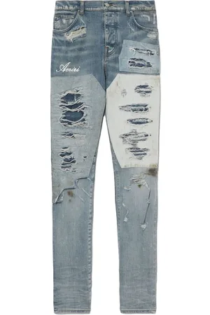 AMIRI Logo-print distressed jeans