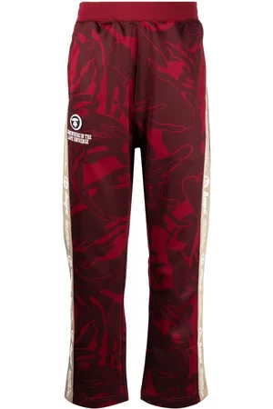 A Bathing Ape Graphic-print logo-patch trousers