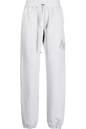 AMIRI Staggered logo-embroidered track pants