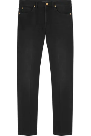 VERSACE Logo-embroidered slim cut jeans