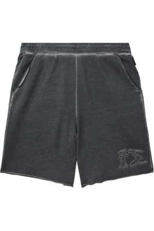 Izzue Distressed cotton track shorts