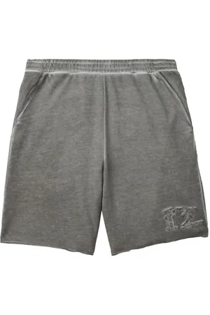 Izzue Distressed cotton track shorts