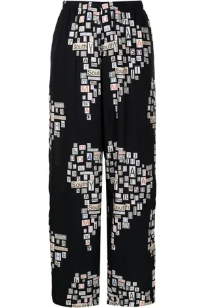 AMIR SLAMA Text-print straight-leg trousers