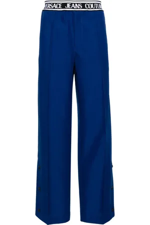 VERSACE Logo-waistband pleated wide-leg trousers