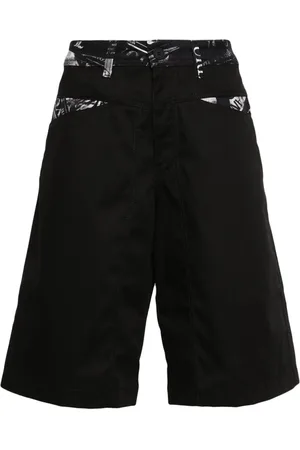 VERSACE Newspaper-patchwork shorts