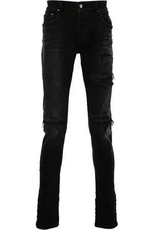 AMIRI Distressed skinny jeans