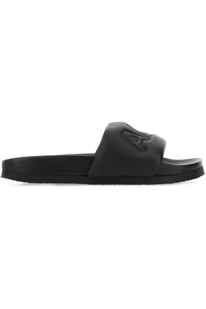 AMBUSH Logo-embossed leather slippers