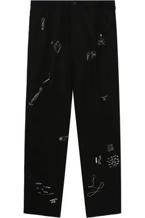 UNDERCOVER Cartoon-print trousers