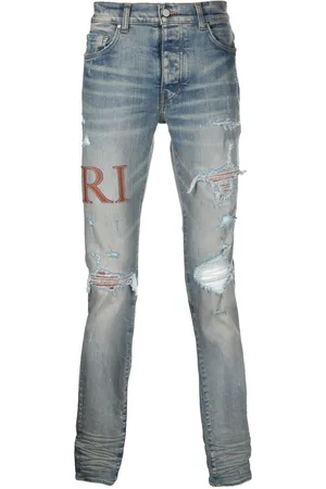 AMIRI Leather-stitch logo skinny jeans