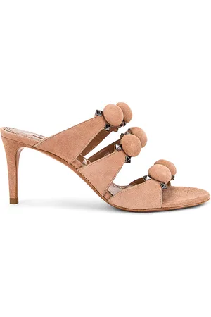 Alaïa Pom Pom Studded Mules in Beige