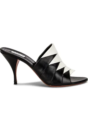 Alaïa Leather Mules in Black