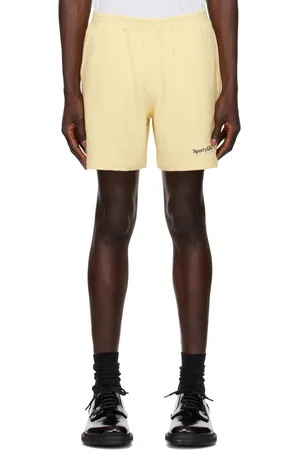 Sporty & Rich Yellow Serif Logo Gym Shorts